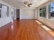 Bright, open-concept living room features hardwood floors and lots of natural light from the large windows at 9319 Bronze River Ave, Las Vegas, NV 89149