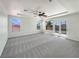Spacious main bedroom with large windows and a tray ceiling at 9319 Bronze River Ave, Las Vegas, NV 89149