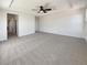 Expansive main bedroom with plush carpet and a ceiling fan at 9319 Bronze River Ave, Las Vegas, NV 89149