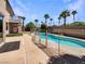 Refreshing private pool surrounded by lush landscaping and a secure fence for safety at 9319 Bronze River Ave, Las Vegas, NV 89149