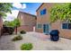 Private backyard with stone landscaping, brick patio, and a barbecue grill, perfect for outdoor entertaining at 9629 Toy Soldier St, Las Vegas, NV 89178
