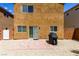 View of the backyard featuring a brick patio and a grill, offering a cozy outdoor living space at 9629 Toy Soldier St, Las Vegas, NV 89178