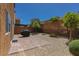 A backyard with gravel, stone pavers and a barbeque at 9629 Toy Soldier St, Las Vegas, NV 89178