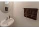 Cozy bathroom features pedestal sink and decorative towel bar at 9629 Toy Soldier St, Las Vegas, NV 89178