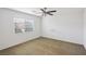 Neutral carpeted bedroom with window and blinds and white walls at 9629 Toy Soldier St, Las Vegas, NV 89178