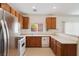 Functional kitchen featuring stainless steel appliances, breakfast bar, and neutral countertops at 9629 Toy Soldier St, Las Vegas, NV 89178
