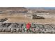 This aerial view showcases the home among similar homes in a planned desert community at 9917 Fletcher Peak Ave, Las Vegas, NV 89178