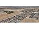 This aerial view features the Primary-planned community's layout and nearby shopping centers at 9917 Fletcher Peak Ave, Las Vegas, NV 89178