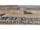 This aerial view showcases the home's location in a desert landscape community with views at 9917 Fletcher Peak Ave, Las Vegas, NV 89178
