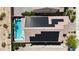 Aerial view of the property featuring a sparkling blue pool and solar panels on the roof at 9917 Fletcher Peak Ave, Las Vegas, NV 89178