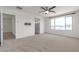 Bright bedroom featuring carpeted floors and a view of the mountains at 9917 Fletcher Peak Ave, Las Vegas, NV 89178