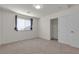 Light-filled bedroom with closet, light gray carpet and neutral walls at 9917 Fletcher Peak Ave, Las Vegas, NV 89178