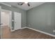 This bedroom features a calming green wall color and neutral flooring, creating a serene living space at 9917 Fletcher Peak Ave, Las Vegas, NV 89178