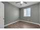 Bright bedroom with green walls, neutral floors, and a window with blinds, providing a peaceful ambiance at 9917 Fletcher Peak Ave, Las Vegas, NV 89178