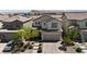 Charming two-story home with a well-manicured front yard and a paved driveway at 9917 Fletcher Peak Ave, Las Vegas, NV 89178