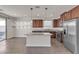 Bright kitchen features stainless steel appliances, granite countertops, and an island with pendant lighting at 9917 Fletcher Peak Ave, Las Vegas, NV 89178