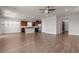 Spacious living area features hardwood floors and seamlessly connects to the modern kitchen, creating an open-concept design at 9917 Fletcher Peak Ave, Las Vegas, NV 89178