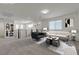 Bright loft area with contemporary furnishings, neutral carpet, and stylish decor at 9917 Fletcher Peak Ave, Las Vegas, NV 89178