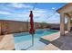 Inviting backyard pool and outdoor seating area, great for relaxation and gatherings at 9917 Fletcher Peak Ave, Las Vegas, NV 89178