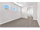 Bedroom with carpet, natural light, and hallway access, offering space and convenience at 10345 Howling Coyote Ave, Las Vegas, NV 89135