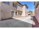 This home showcases a clean, stucco exterior with a charming entrance and well-maintained landscaping at 10345 Howling Coyote Ave, Las Vegas, NV 89135