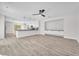 Spacious open floor plan with light wood flooring and modern built-ins at 10345 Howling Coyote Ave, Las Vegas, NV 89135