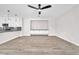Open floor plan featuring a living area with modern built-ins and light wood flooring at 10345 Howling Coyote Ave, Las Vegas, NV 89135