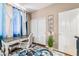 A cozy bedroom featuring a desk, chair, and carpet with ample closet space at 10701 Windrose Point Ave, Las Vegas, NV 89144