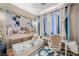 A cozy bedroom featuring a desk, chair, carpet and daybed at 10701 Windrose Point Ave, Las Vegas, NV 89144