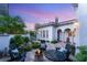 Beautifully landscaped backyard patio with comfortable seating and a cozy fire pit for outdoor enjoyment at 10717 Beringer Dr, Las Vegas, NV 89144