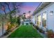 Lush backyard garden with manicured lawn and flower beds at 10717 Beringer Dr, Las Vegas, NV 89144