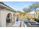 Luxurious backyard with pool, spa, outdoor dining, fire pit, and comfortable lounge seating at 10717 Beringer Dr, Las Vegas, NV 89144