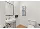 Bright half-bath features modern fixtures, tiled floors, and fresh decor at 10717 Beringer Dr, Las Vegas, NV 89144