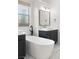Modern bathroom features a standalone tub, black fixtures, and updated vanity at 10717 Beringer Dr, Las Vegas, NV 89144
