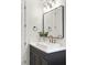Updated bathroom vanity features modern fixtures and a sleek mirror, providing a modern aesthetic at 10717 Beringer Dr, Las Vegas, NV 89144