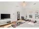 Bright bedroom featuring hardwood floors, neutral walls, ample natural light and an adjacent workout area at 10717 Beringer Dr, Las Vegas, NV 89144