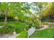 Picturesque walking path through lush landscaping provides a tranquil escape within the community at 10717 Beringer Dr, Las Vegas, NV 89144