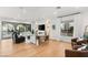 Bright and airy living room features hardwood floors, modern furnishings, and seamless access to outdoor patio at 10717 Beringer Dr, Las Vegas, NV 89144