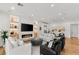 Spacious living room with fireplace, hardwood floors, and white and black furniture at 10717 Beringer Dr, Las Vegas, NV 89144