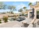 Backyard pool with integrated spa, outdoor lounge area, and lush landscaping at 10717 Beringer Dr, Las Vegas, NV 89144