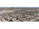 An aerial view presents densely packed community homes, nestled with a mountain backdrop at 10729 Marathon Bell Ln, Las Vegas, NV 89129