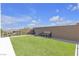 Well maintained backyard with artificial turf, providing a clean and usable outdoor space at 10729 Marathon Bell Ln, Las Vegas, NV 89129