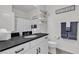 Clean bathroom with a modern vanity, sleek mirror, and stylish decorative elements at 10729 Marathon Bell Ln, Las Vegas, NV 89129