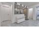 Bright bathroom featuring a glass enclosed shower with decorative tile and stylish flooring at 10729 Marathon Bell Ln, Las Vegas, NV 89129