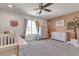 Charming Bedroom with neutral tones, comfortable seating, and plenty of natural light at 10729 Marathon Bell Ln, Las Vegas, NV 89129
