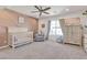 Bright Bedroom features a ceiling fan, decorative accent wall, and ample natural light at 10729 Marathon Bell Ln, Las Vegas, NV 89129