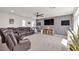 Spacious bonus room complete with modern fan, TV, and comfortable seating, perfect for entertaining at 10729 Marathon Bell Ln, Las Vegas, NV 89129