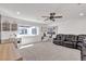 Bright bonus room with built-in office space, large windows, and comfortable seating area at 10729 Marathon Bell Ln, Las Vegas, NV 89129