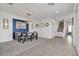 Elegant dining room features a modern chandelier, stylish decor, and seamless flow to the staircase and living area at 10729 Marathon Bell Ln, Las Vegas, NV 89129