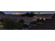 An exterior view showcases houses, landscaping, and the Las Vegas skyline at 10729 Marathon Bell Ln, Las Vegas, NV 89129